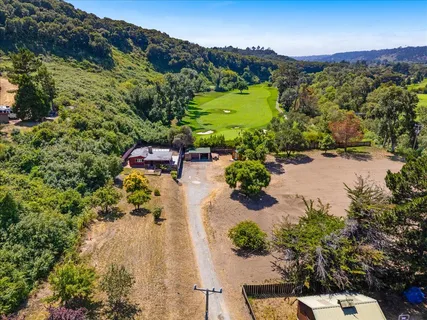 an aerial view of a house with a garden