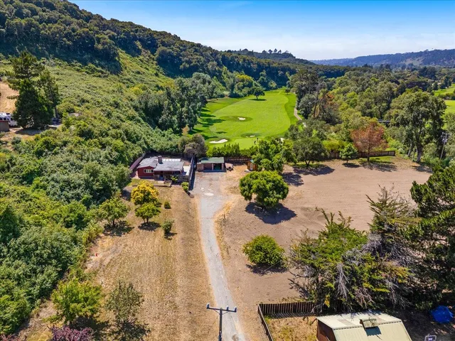 an aerial view of a house with a garden