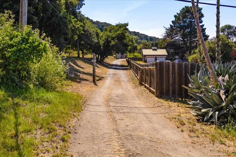 a view of a backyard with sitting area