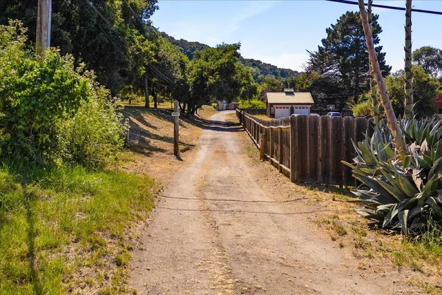 a view of a backyard with sitting area