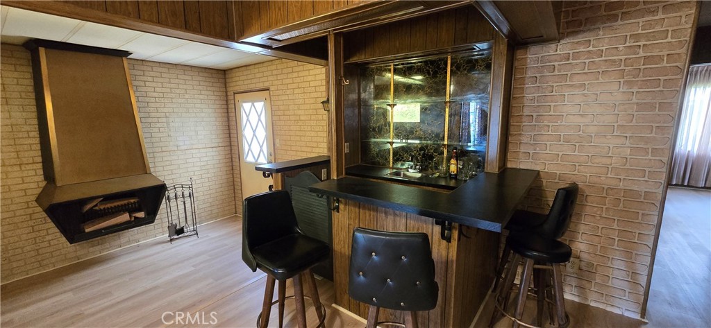 9391 California Avenue, Unit 80 Riverside, CA 92503 - Photo 11 of 28 a room with furniture and wooden floor