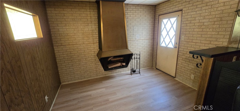 9391 California Avenue, Unit 80 Riverside, CA 92503 - Photo 12 of 28 a view of a livingroom with wooden floor and a window