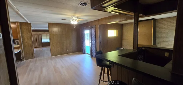 a view of a livingroom with furniture and wooden floor