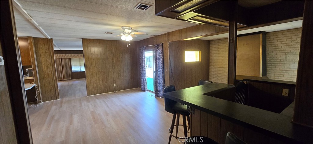 9391 California Avenue, Unit 80 Riverside, CA 92503 - Photo 13 of 28 a view of a livingroom with furniture and wooden floor