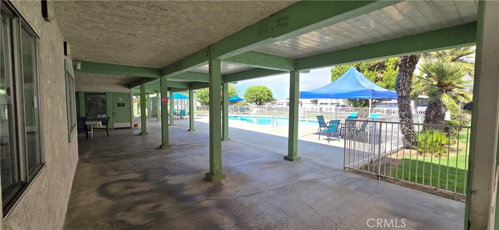 9391 California Avenue, Unit 80 Riverside, CA 92503 - Photo 22 of 28 a view of a porch with furniture and garden