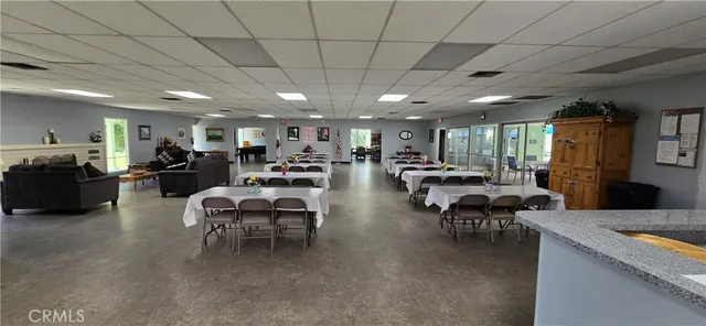 a living room with lots of furniture and a chandelier