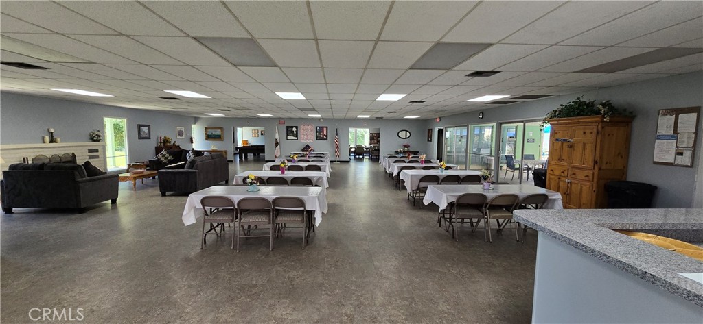 9391 California Avenue, Unit 80 Riverside, CA 92503 - Photo 23 of 28 a living room with lots of furniture and a chandelier