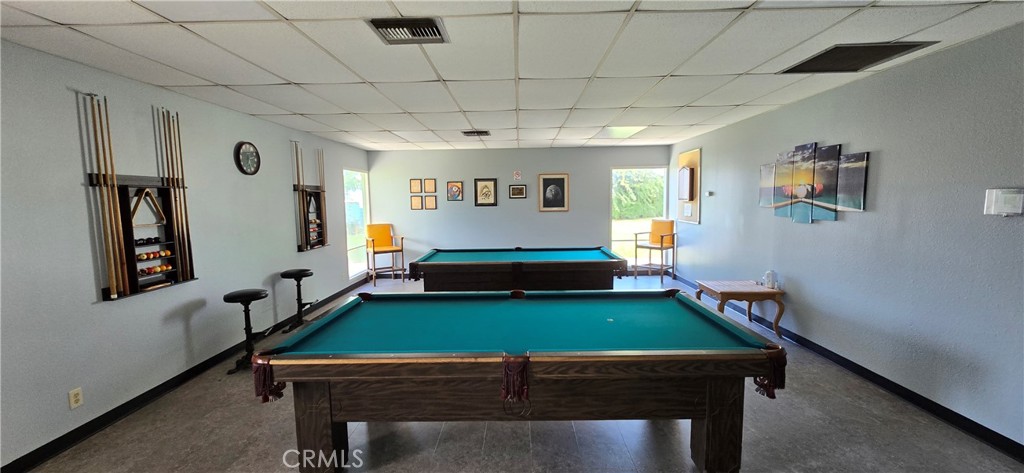 9391 California Avenue, Unit 80 Riverside, CA 92503 - Photo 26 of 28 a room with furniture pool table and windows