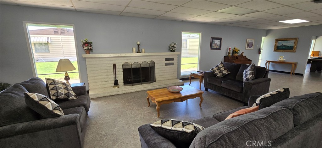 9391 California Avenue, Unit 80 Riverside, CA 92503 - Photo 28 of 28 a living room with furniture and a fireplace