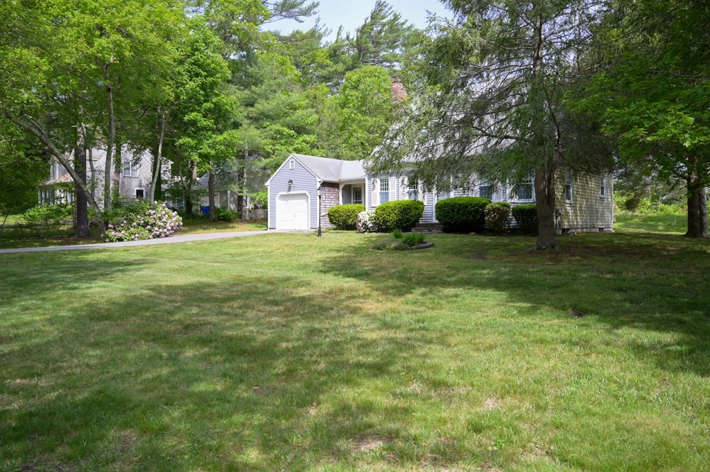 6 Michael Road Bourne, MA 02559 - Photo 3 of 41 a view of a house with a big yard and large trees