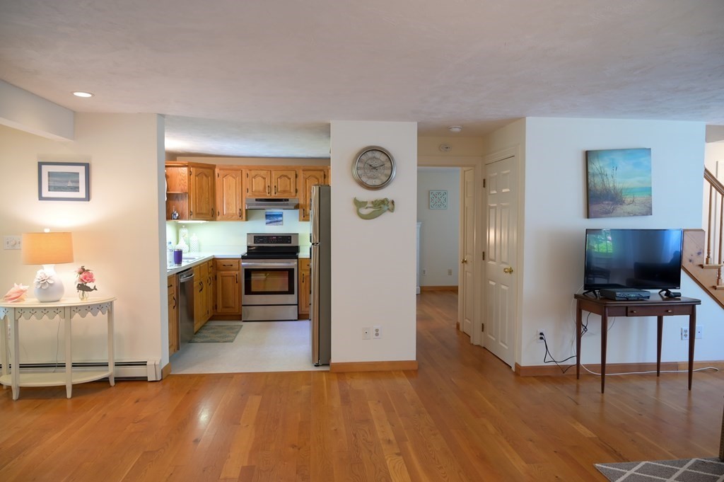 6 Michael Road Bourne, MA 02559 - Photo 9 of 41 a view of a living room kitchen and a wooden floor