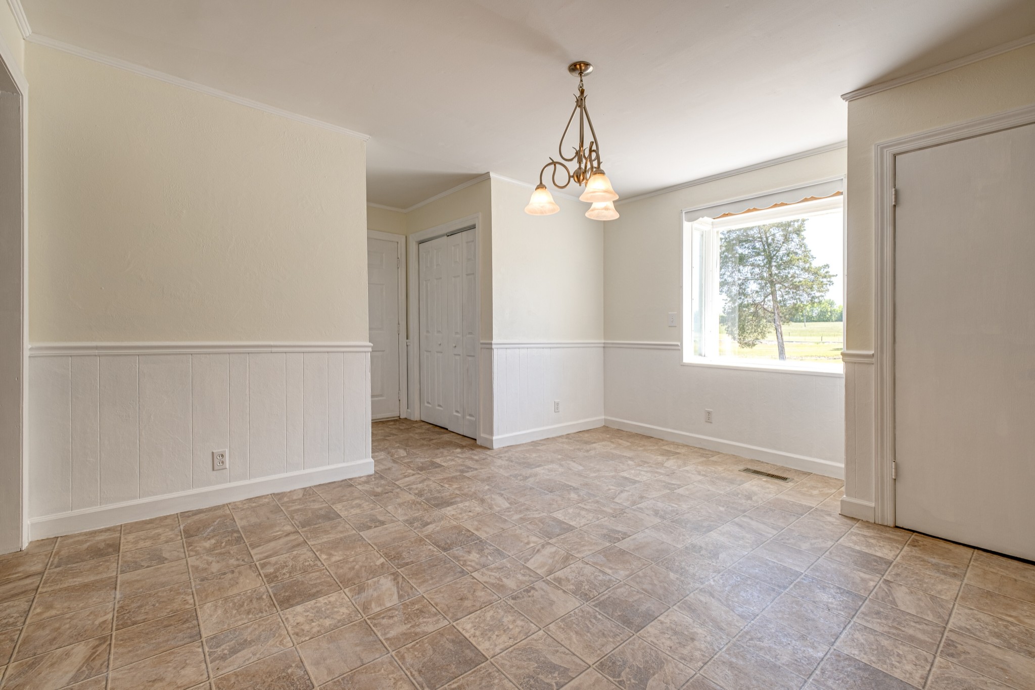 1349 Old Lebanon Dirt Road Mount Juliet, TN 37122 - Photo 11 of 38 an empty room with chandelier fan and windows