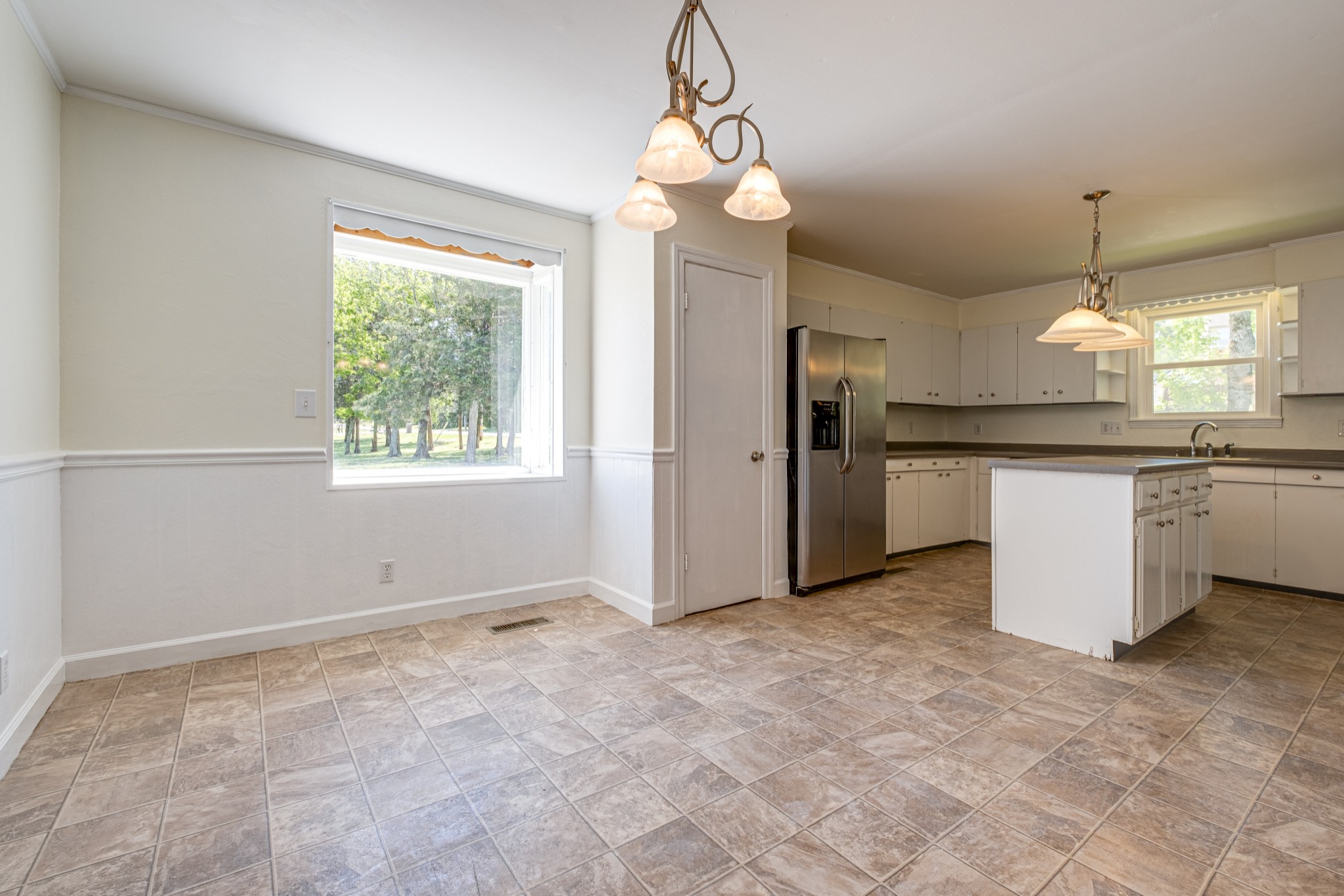1349 Old Lebanon Dirt Road Mount Juliet, TN 37122 - Photo 12 of 38 a view of a kitchen with a sink stainless steel appliances and cabinets