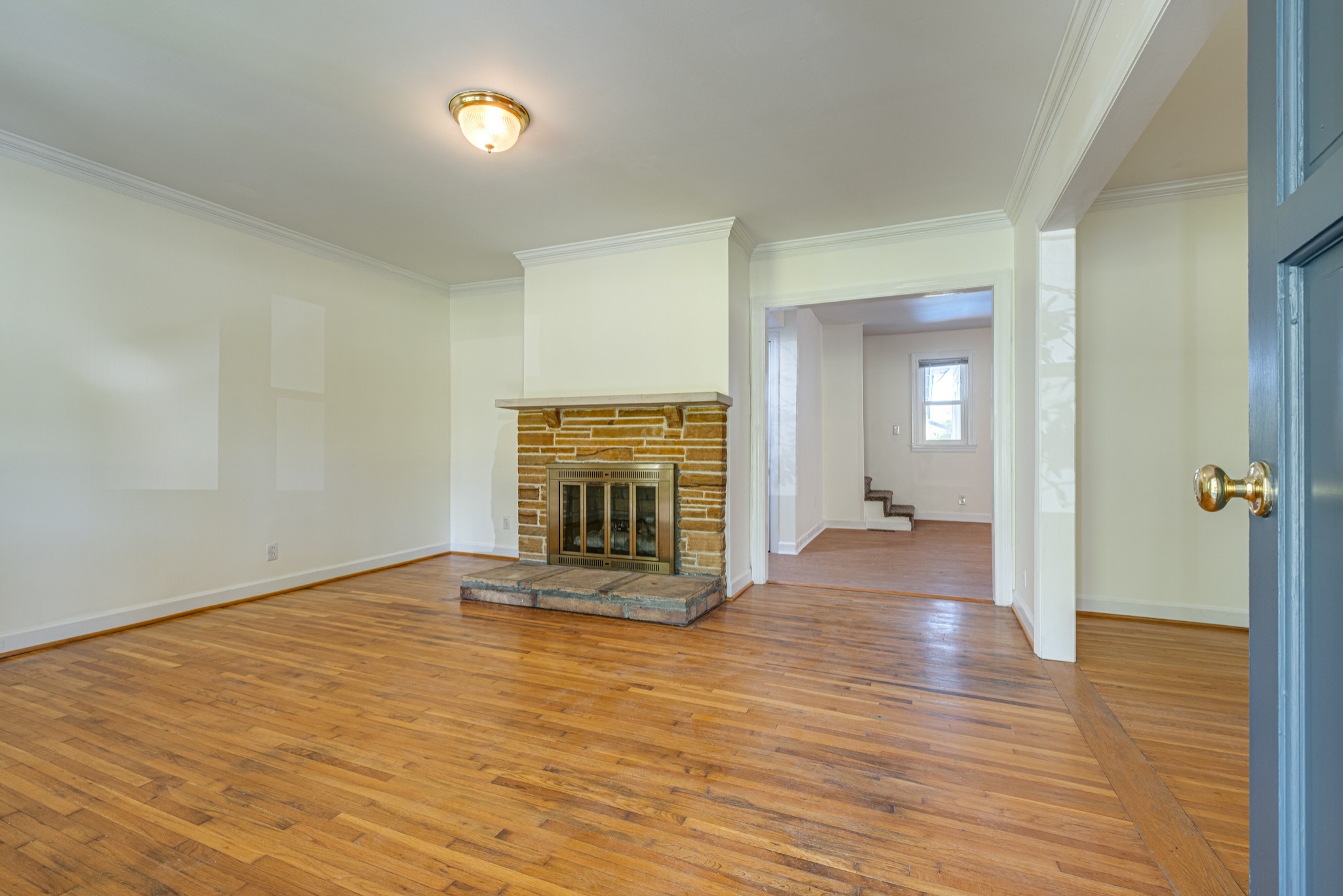 1349 Old Lebanon Dirt Road Mount Juliet, TN 37122 - Photo 6 of 38 an empty room with wooden floor fireplace and windows