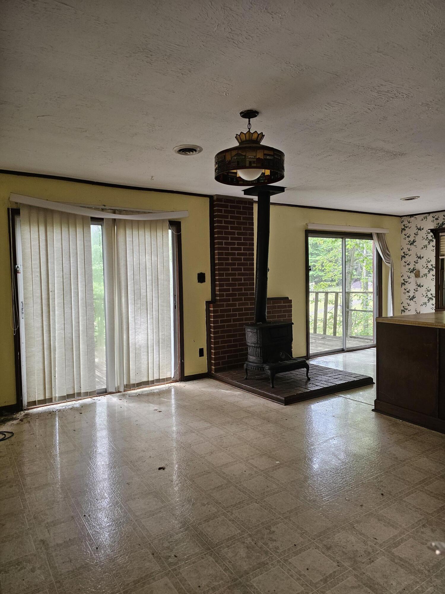 145 Carlos Road Union Hall, VA 24176 - Photo 9 of 17 a view of an empty room with a window and wooden floor