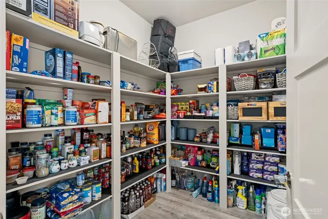 a shelf with books and knick knacks on it