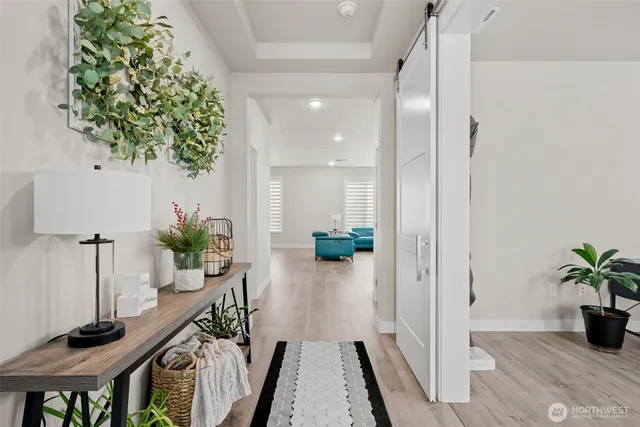 a very nice looking hallway with a potted plant