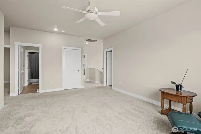 a view of a livingroom with a ceiling fan