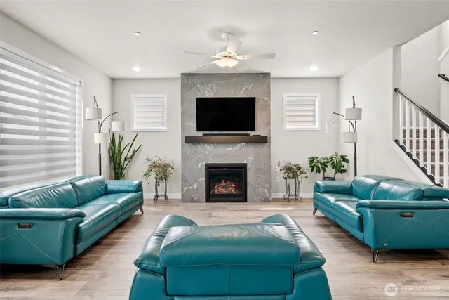 a living room with furniture and a fireplace