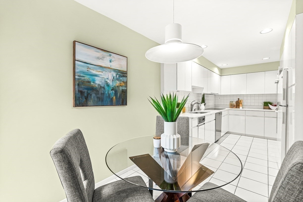 67 Algonquin Road, Unit 67 Newton, MA 02467 - Photo 15 of 38 a view of a dining room with furniture and wooden floor
