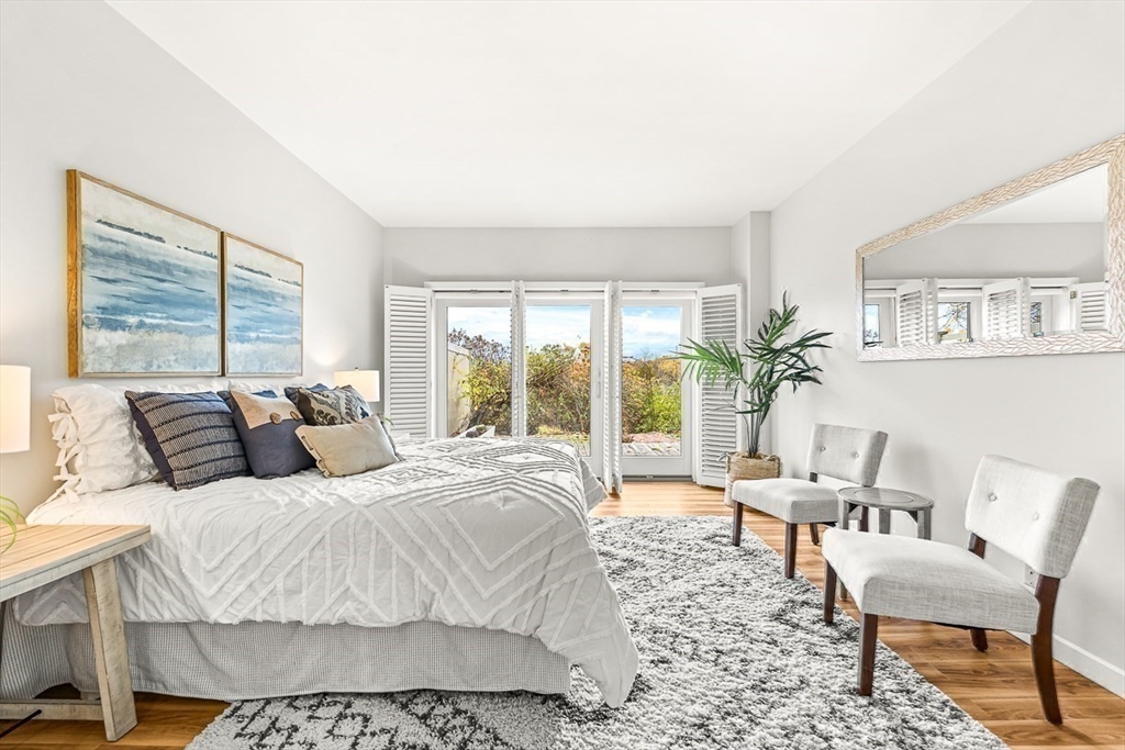 67 Algonquin Road, Unit 67 Newton, MA 02467 - Photo 23 of 38 a large bedroom with a bed and large window