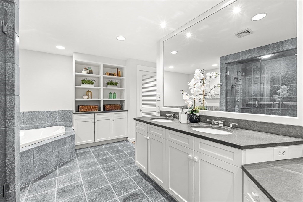 67 Algonquin Road, Unit 67 Newton, MA 02467 - Photo 29 of 38 a kitchen with a sink and a stove top oven
