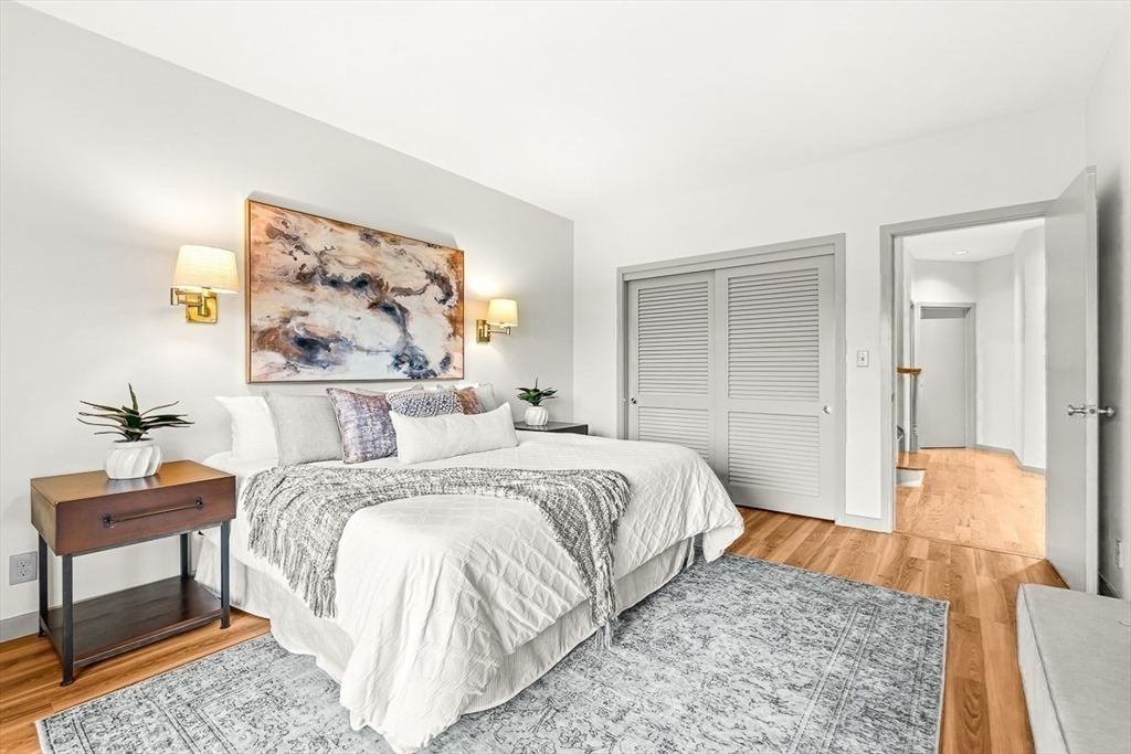 67 Algonquin Road, Unit 67 Newton, MA 02467 - Photo 31 of 38 a bedroom with a bed and a couch