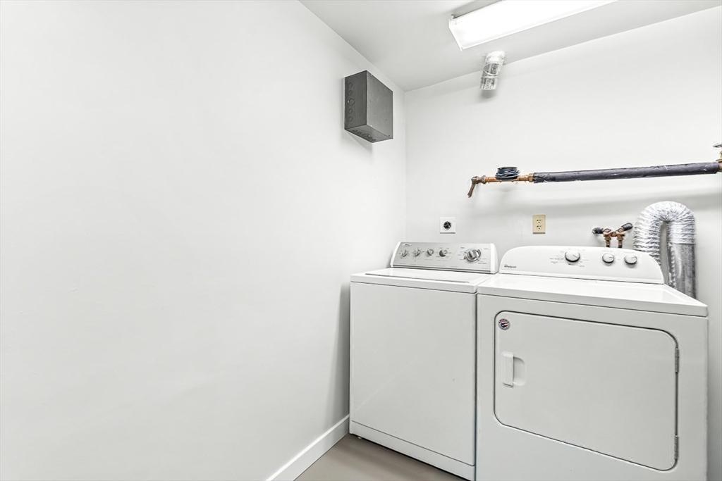 67 Algonquin Road, Unit 67 Newton, MA 02467 - Photo 33 of 38 a utility room with dryer and washer