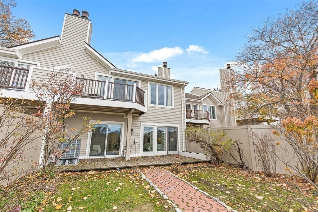 67 Algonquin Road, Unit 67 Newton, MA 02467 - Photo 34 of 38 front view of a house with a yard