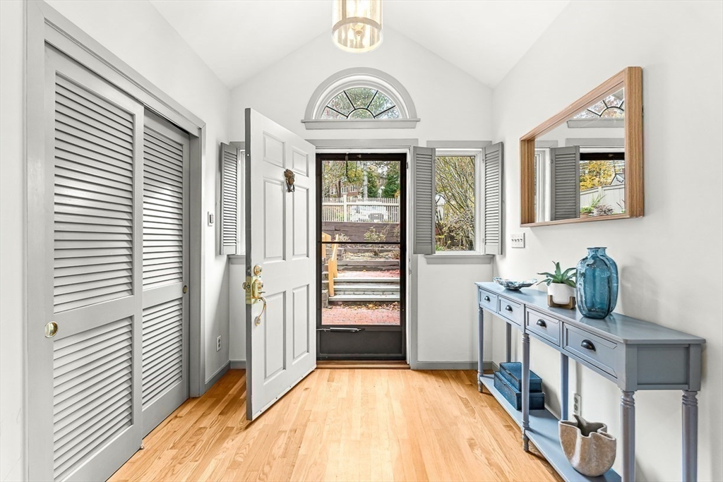 67 Algonquin Road, Unit 67 Newton, MA 02467 - Photo 4 of 38 a view of a hallway to rooms and wooden floor