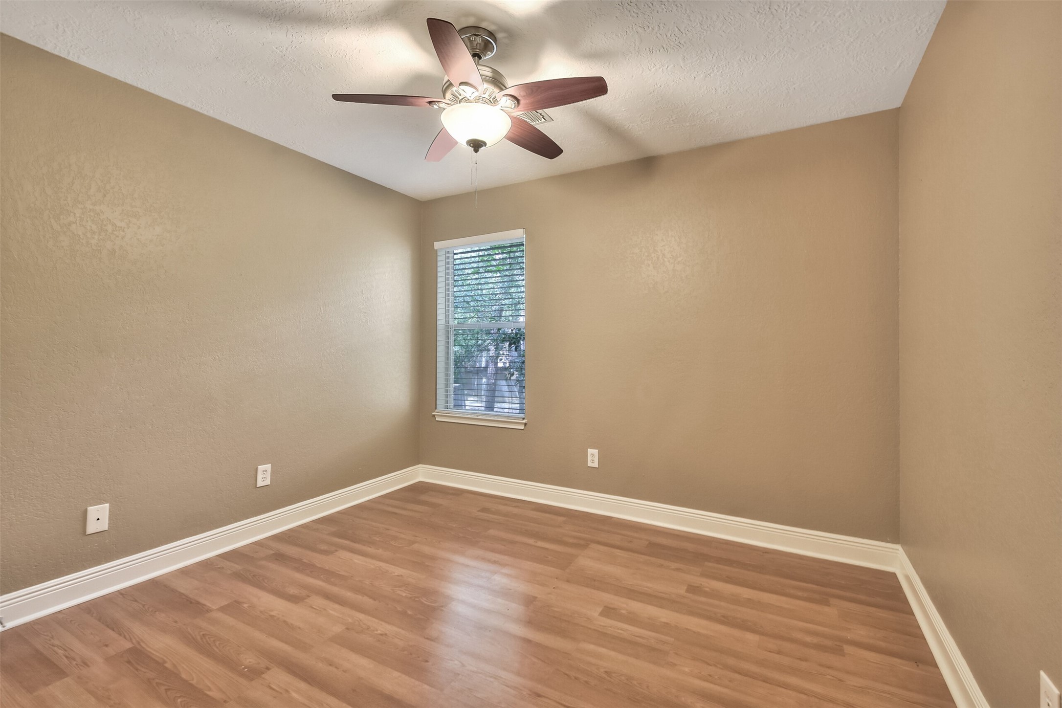 5 East Willowwood Court Spring, TX 77381 - Photo 23 of 27 a view of room with window and ceiling fan