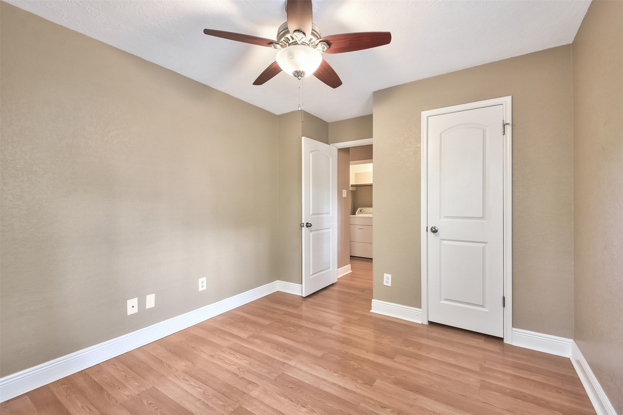 5 East Willowwood Court Spring, TX 77381 - Photo 27 of 27 wooden floor in an empty room with a window