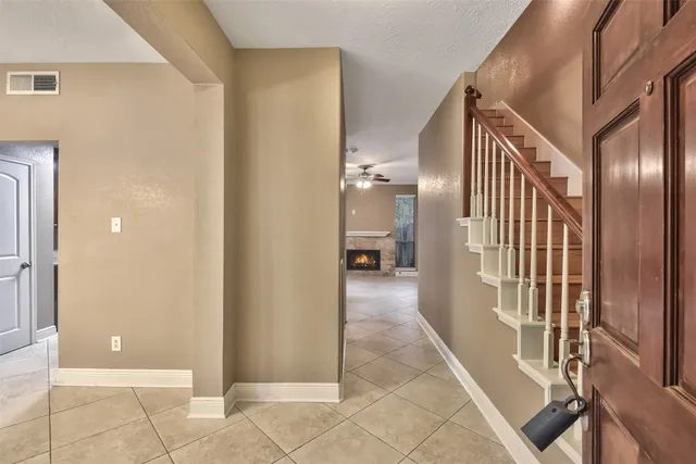 a view of a hallway with a living room