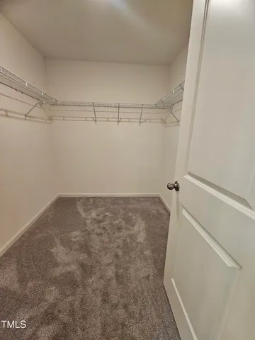 a view of a utility room with wooden floor