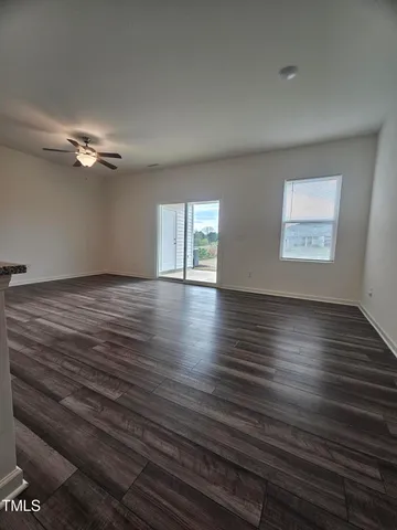 a large kitchen with kitchen island granite countertop a large counter top and wooden floor