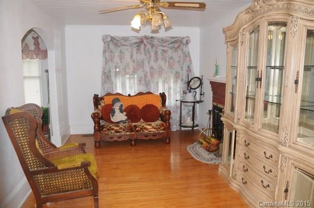 1673 Cat Square Road Vale, NC 28168 - Photo 15 of 24 a living room with furniture a chandelier and a fireplace