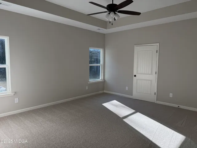 a bathroom with a tub and shower