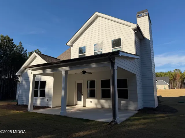 a view of house with yard