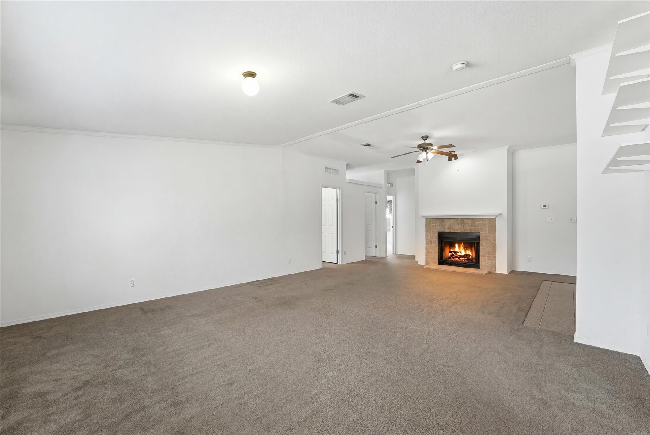 351 County Road 6501 Dayton, TX 77535 - Photo 12 of 29 an empty room with a fireplace