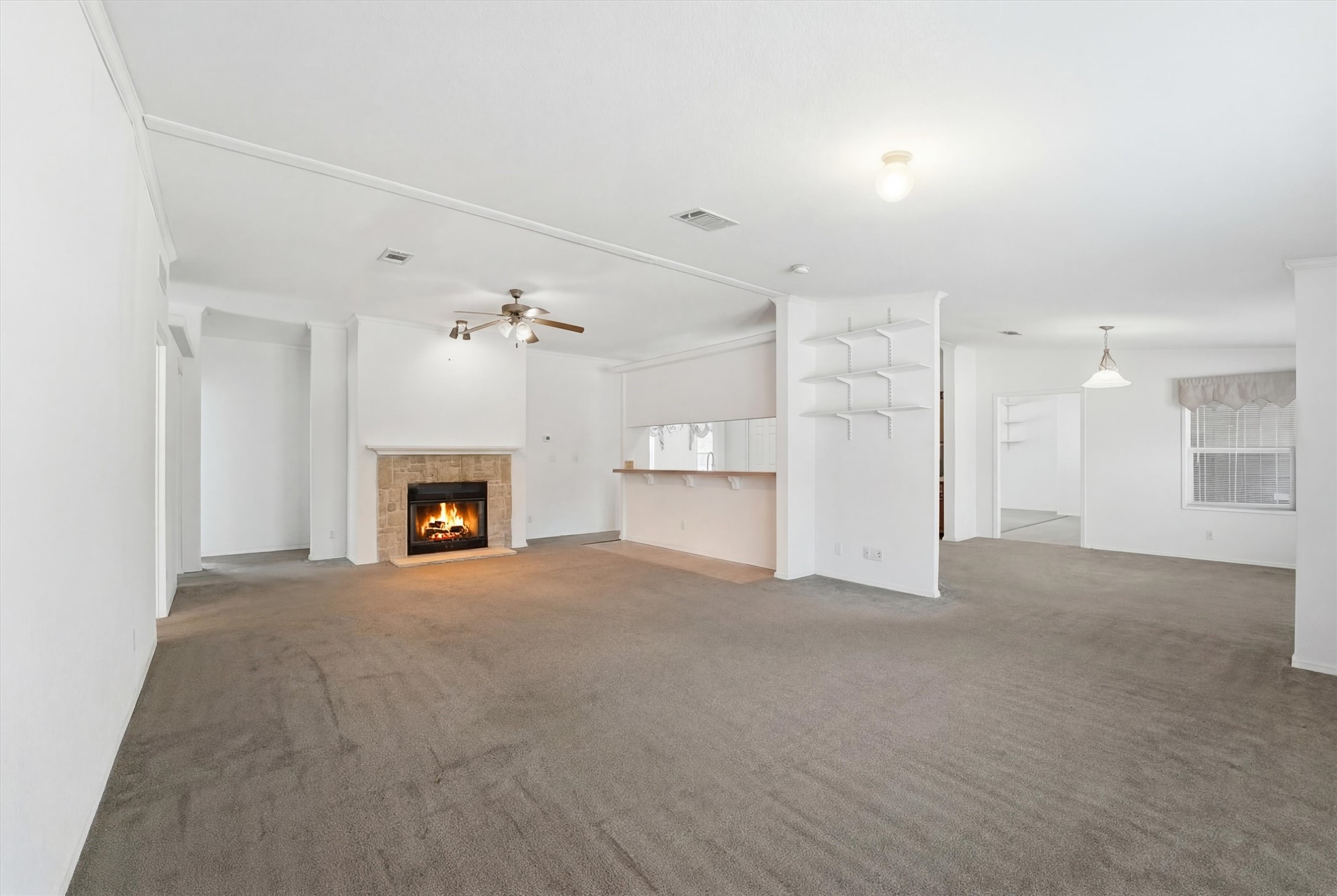 351 County Road 6501 Dayton, TX 77535 - Photo 13 of 29 a view of an empty room with a fireplace
