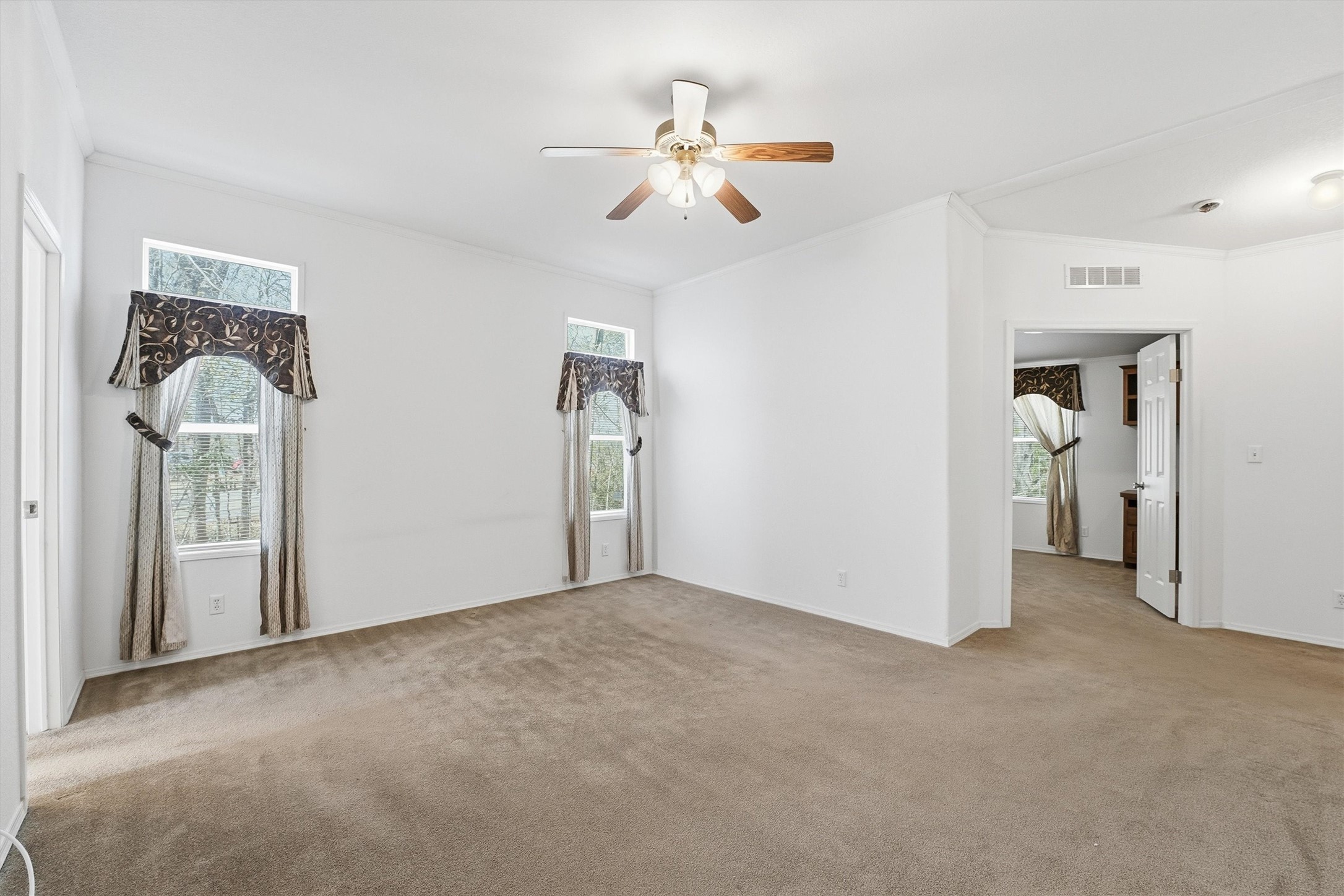 351 County Road 6501 Dayton, TX 77535 - Photo 16 of 29 a view of a livingroom with a ceiling fan and window