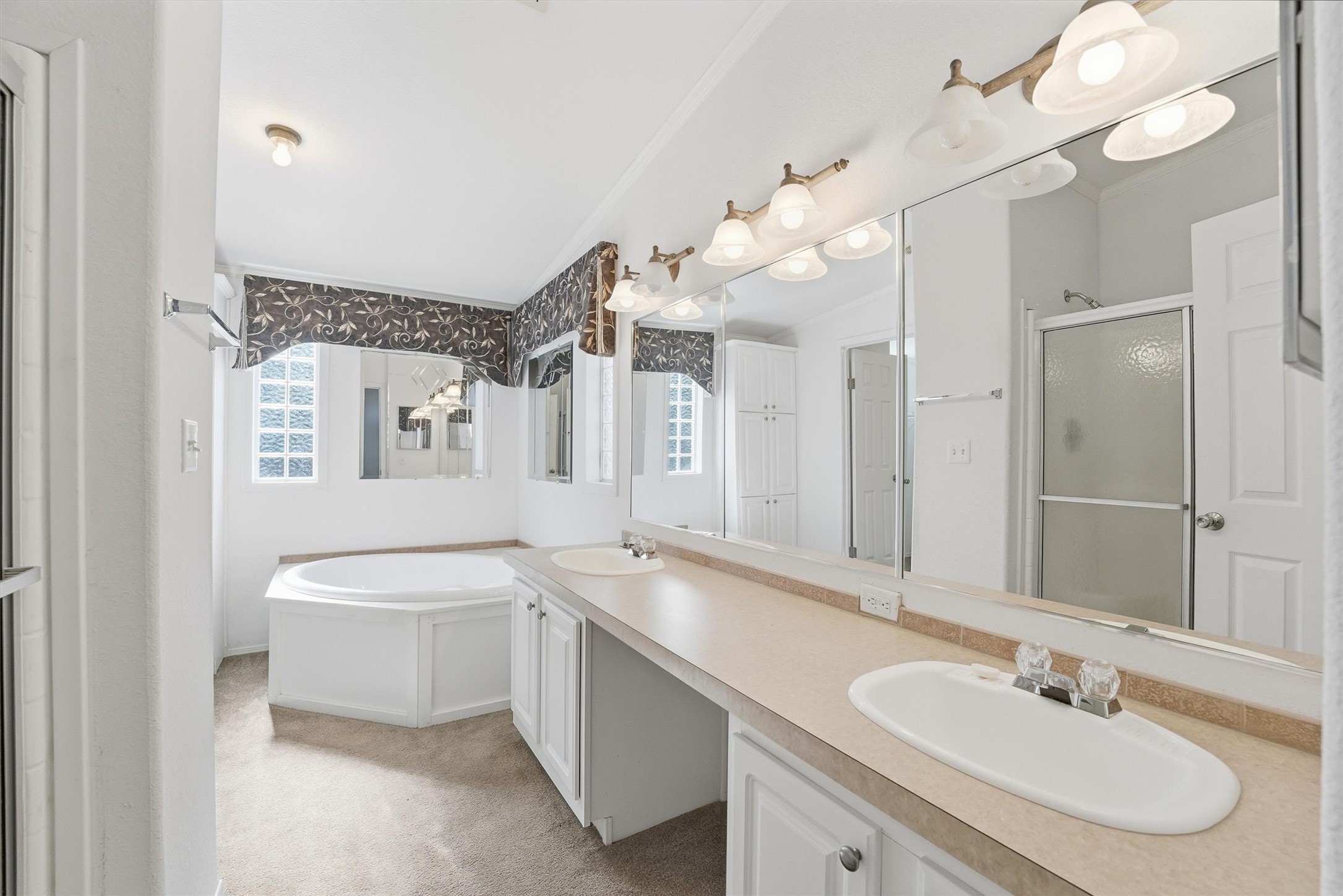 351 County Road 6501 Dayton, TX 77535 - Photo 18 of 29 a bathroom with a sink a toilet a mirror and shower