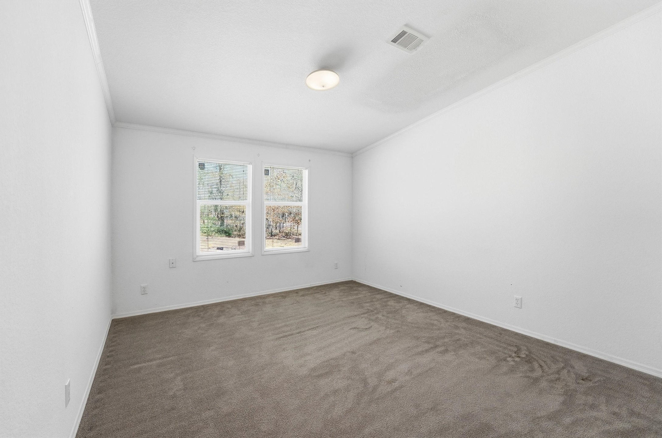 351 County Road 6501 Dayton, TX 77535 - Photo 19 of 29 an empty room with windows