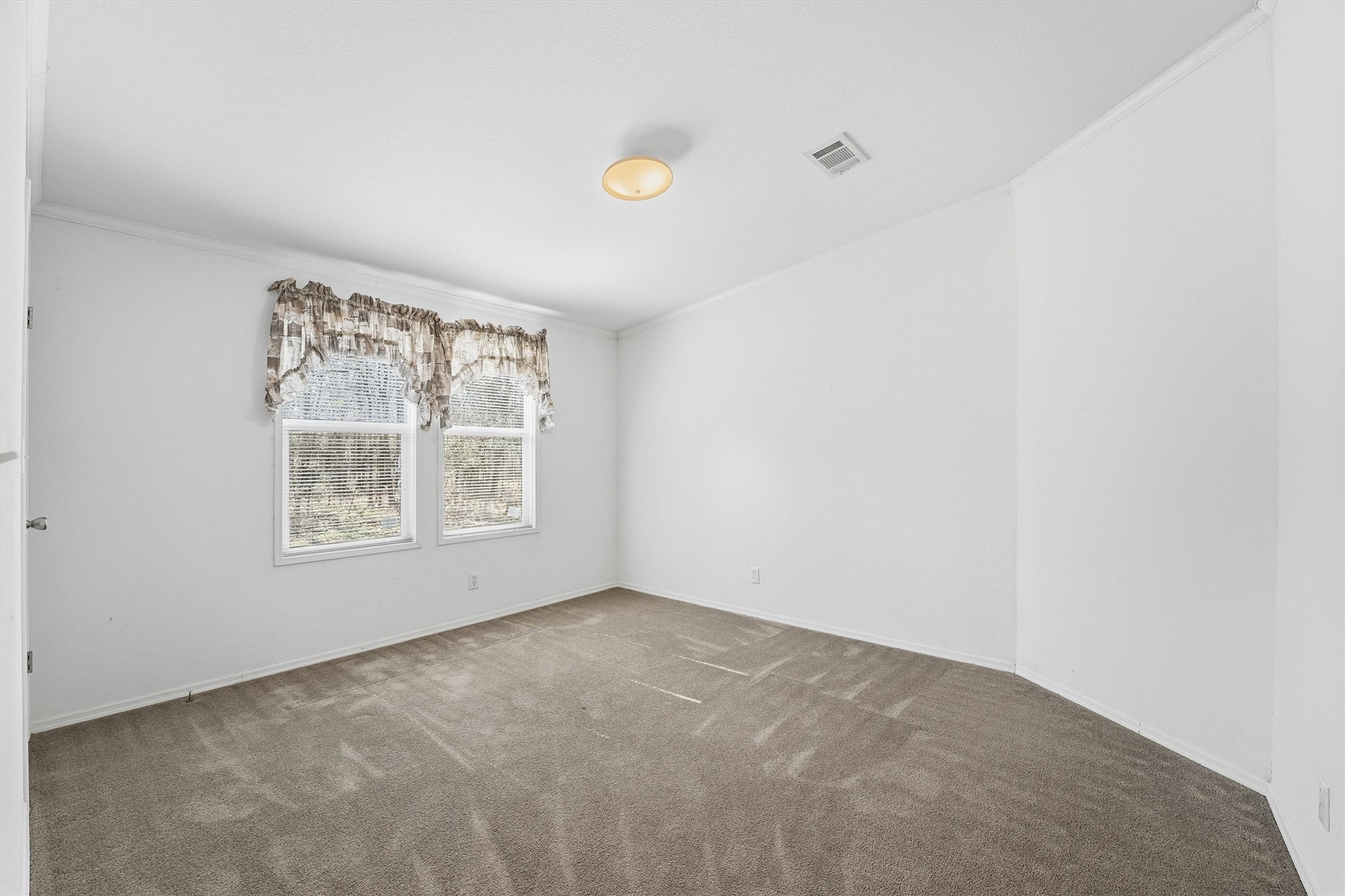 351 County Road 6501 Dayton, TX 77535 - Photo 21 of 29 a view of an empty room with a window