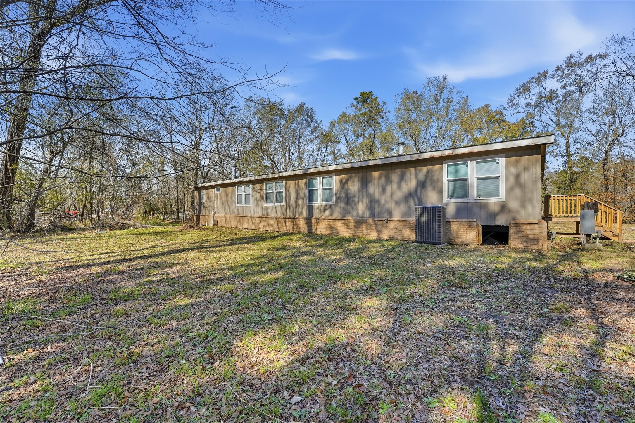 351 County Road 6501 Dayton, TX 77535 - Photo 22 of 29 a view of a house with backyard and trees
