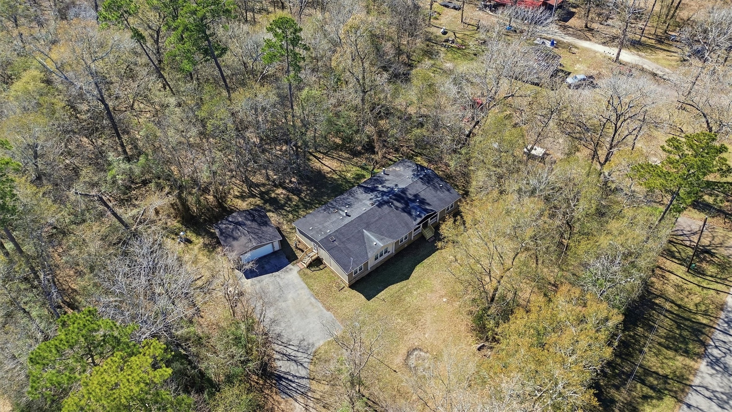351 County Road 6501 Dayton, TX 77535 - Photo 24 of 29 a view of a yard with a tree