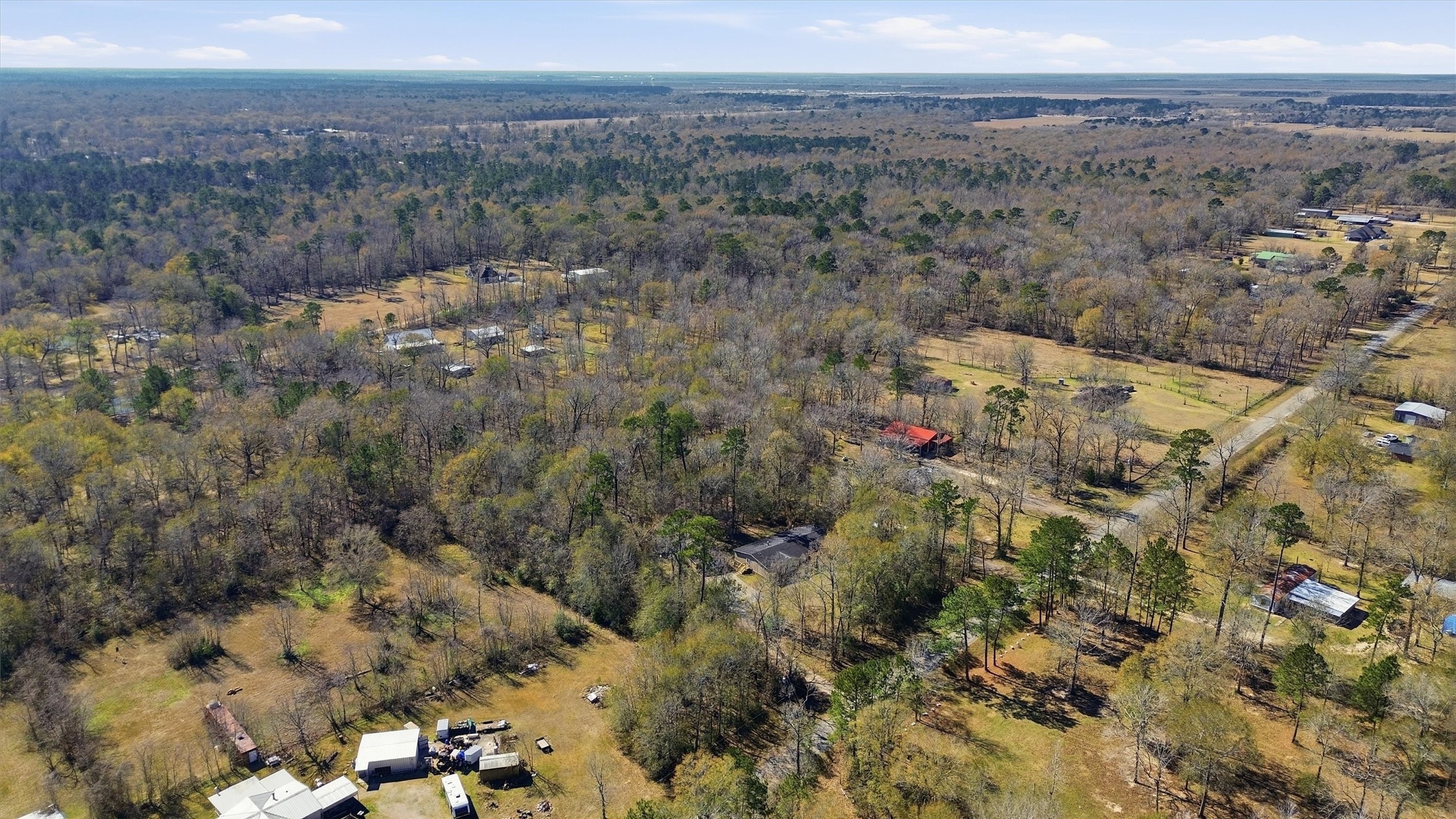 351 County Road 6501 Dayton, TX 77535 - Photo 27 of 29 an aerial view of house with yard and mountain view in back