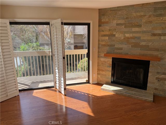 a kitchen with stainless steel appliances a refrigerator a sink a stove a microwave and cabinetry