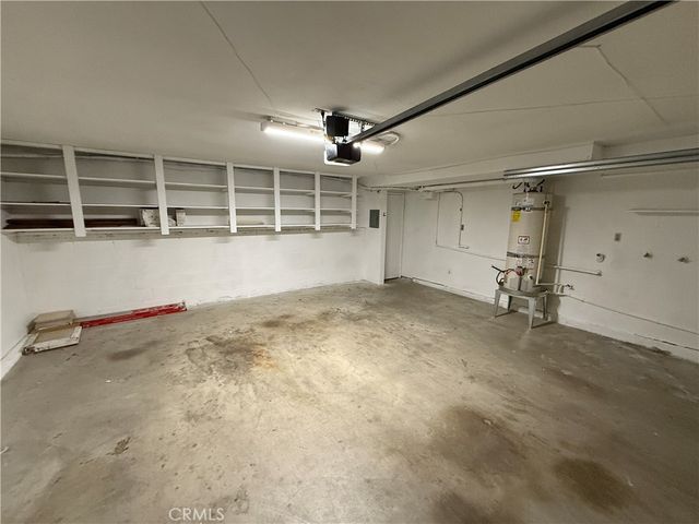 a bathroom with a window and a shower