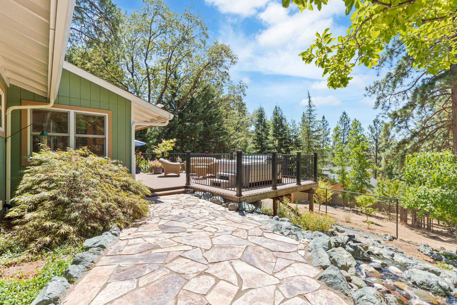 a view of a backyard with sitting area
